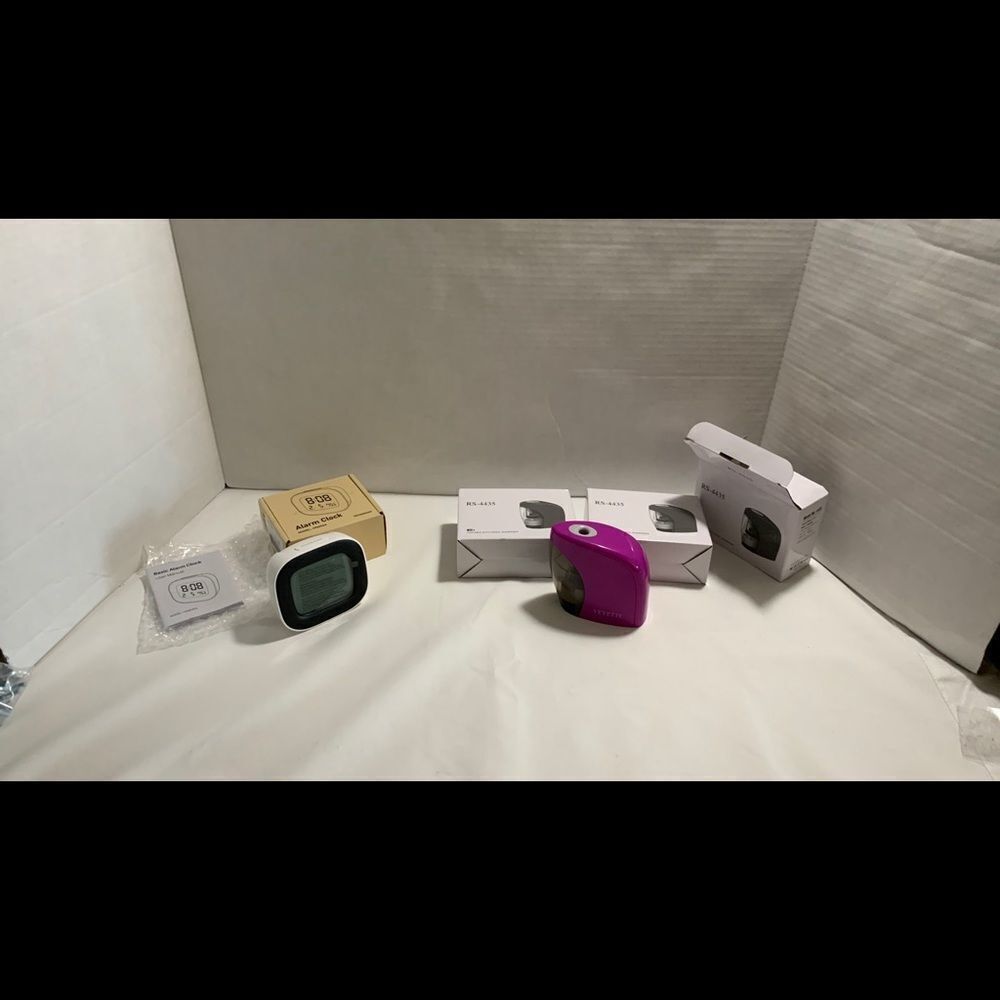 Bundle of 3 pencil sharpeners & 1 alarm clock.  Great for white elephant gifts